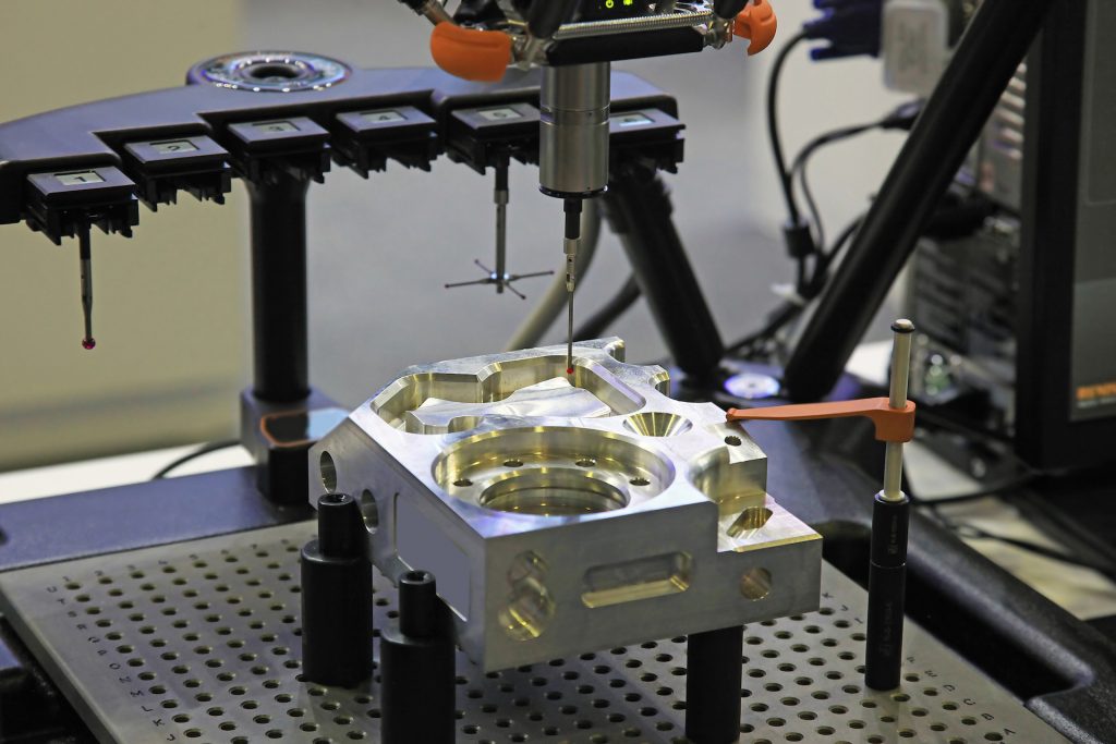 Precision measurement of a metal component using a coordinate measuring machine (CMM)